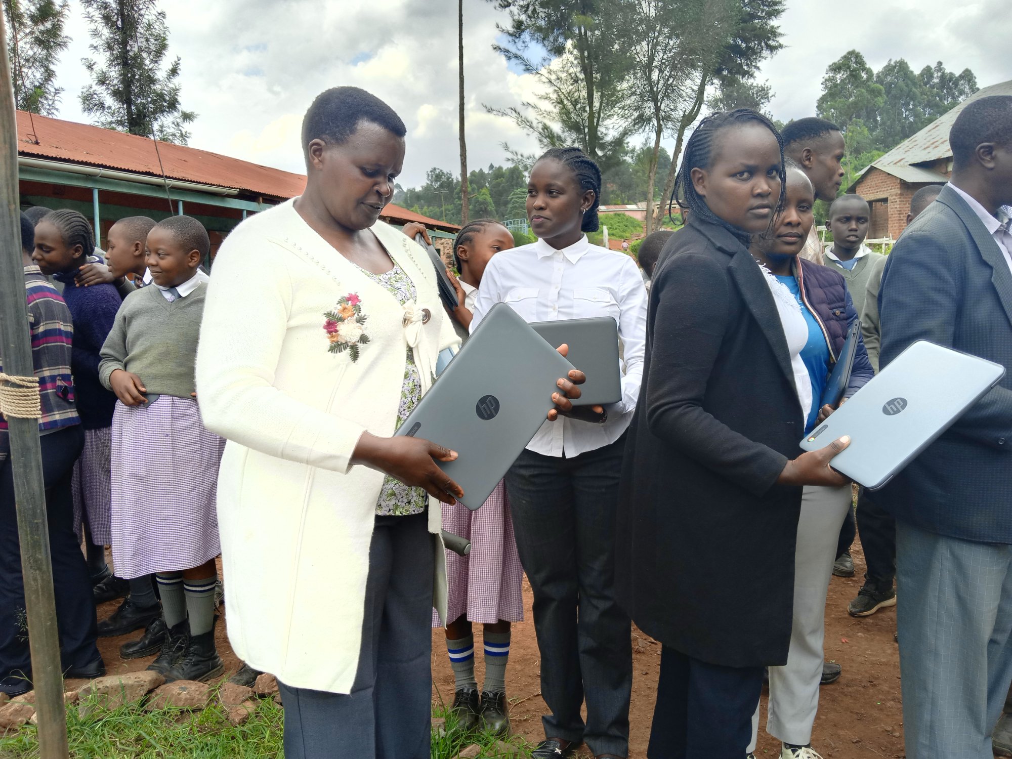 Teachers receiving training on laptops